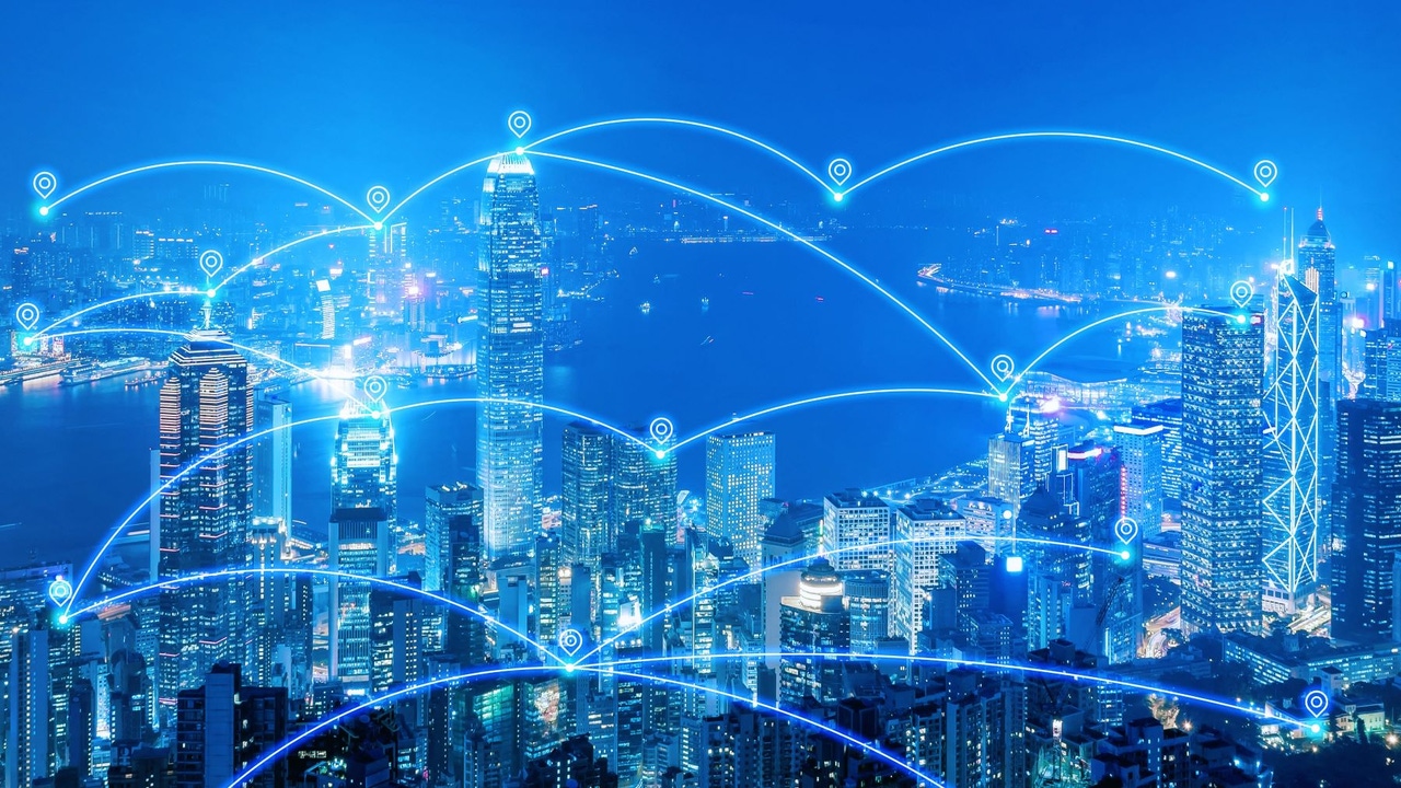 Overlay indicating the use of IoT (Internet of Things) on top of a city skyline