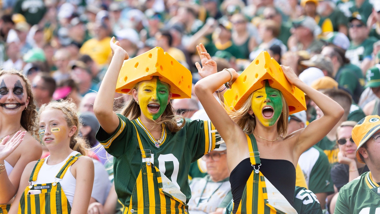 Green Bay Packers' fans cheer during a game against the Indianapolis Colts in Green Bay, Wisconsin Green Bay Packers' fans cheer during a game against the Indianapolis Colts in Green Bay, Wisconsin