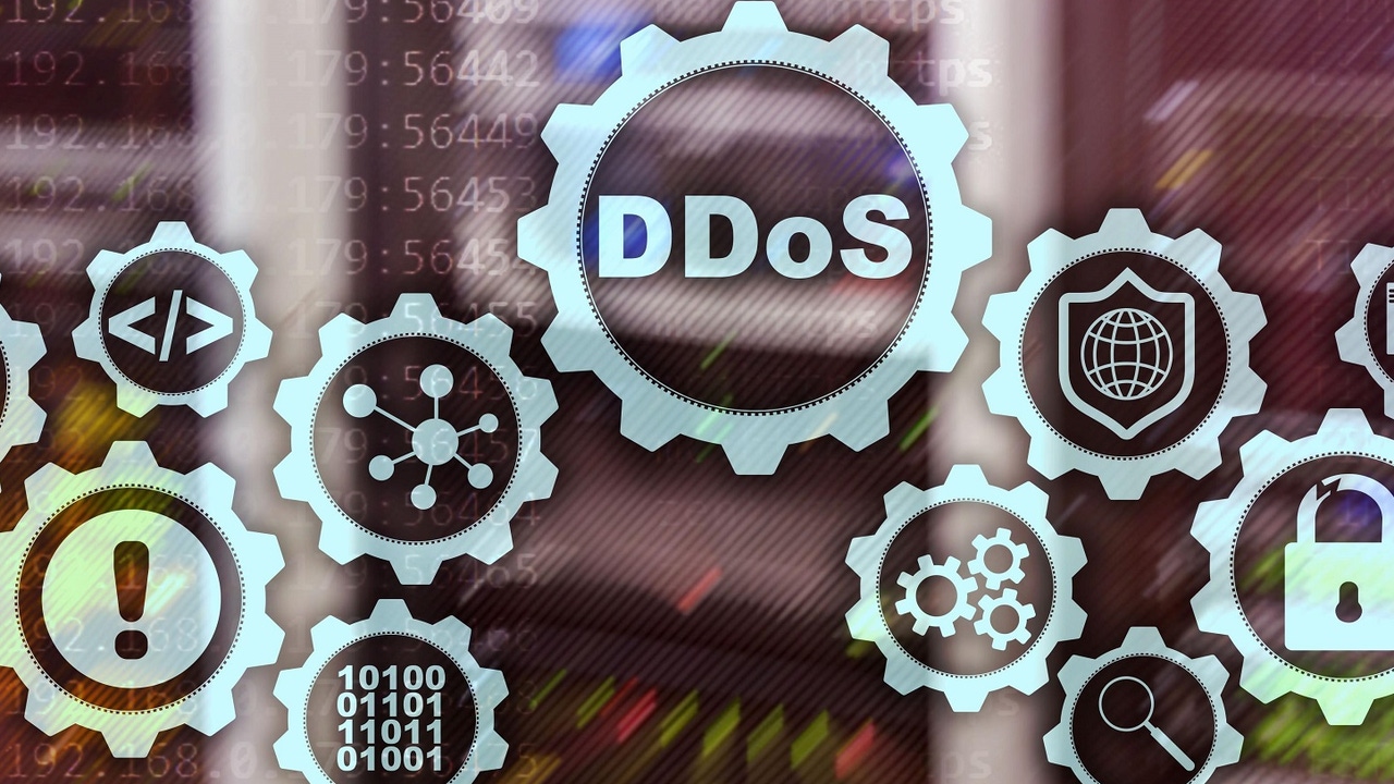 The word DDoS inside a jagged circle with various other tech and security icons surrounding it with similar borders The word DDoS inside a jagged circle with various other tech and security icons surrounding it with similar borders