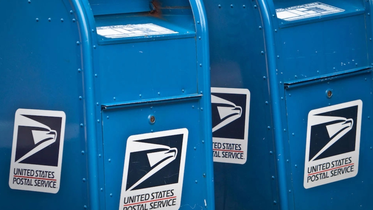 Two blue US Postal Service mailboxes Two blue US Postal Service mailboxes
