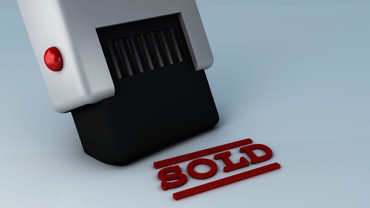 A stamp printing out the word SOLD in red ink. A stamp printing out the word SOLD in red ink.