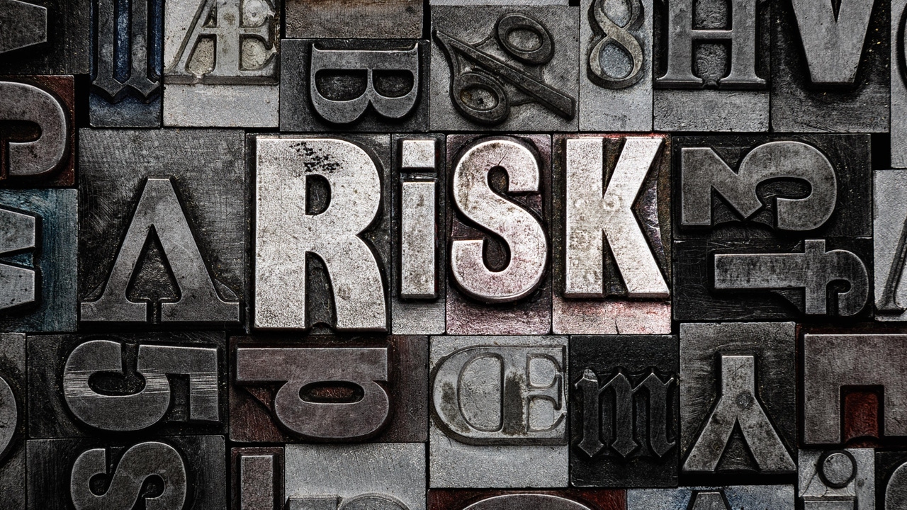 The word "RISK" made from old metal letterpress letters The word "RISK" made from old metal letterpress letters