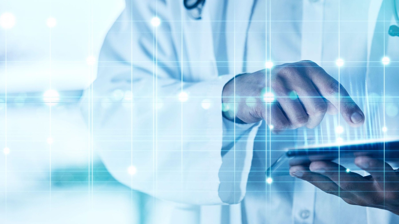 Doctor using a tablet in a hospital with digital overlay or CGI. Doctor using a tablet in a hospital with digital overlay or CGI.