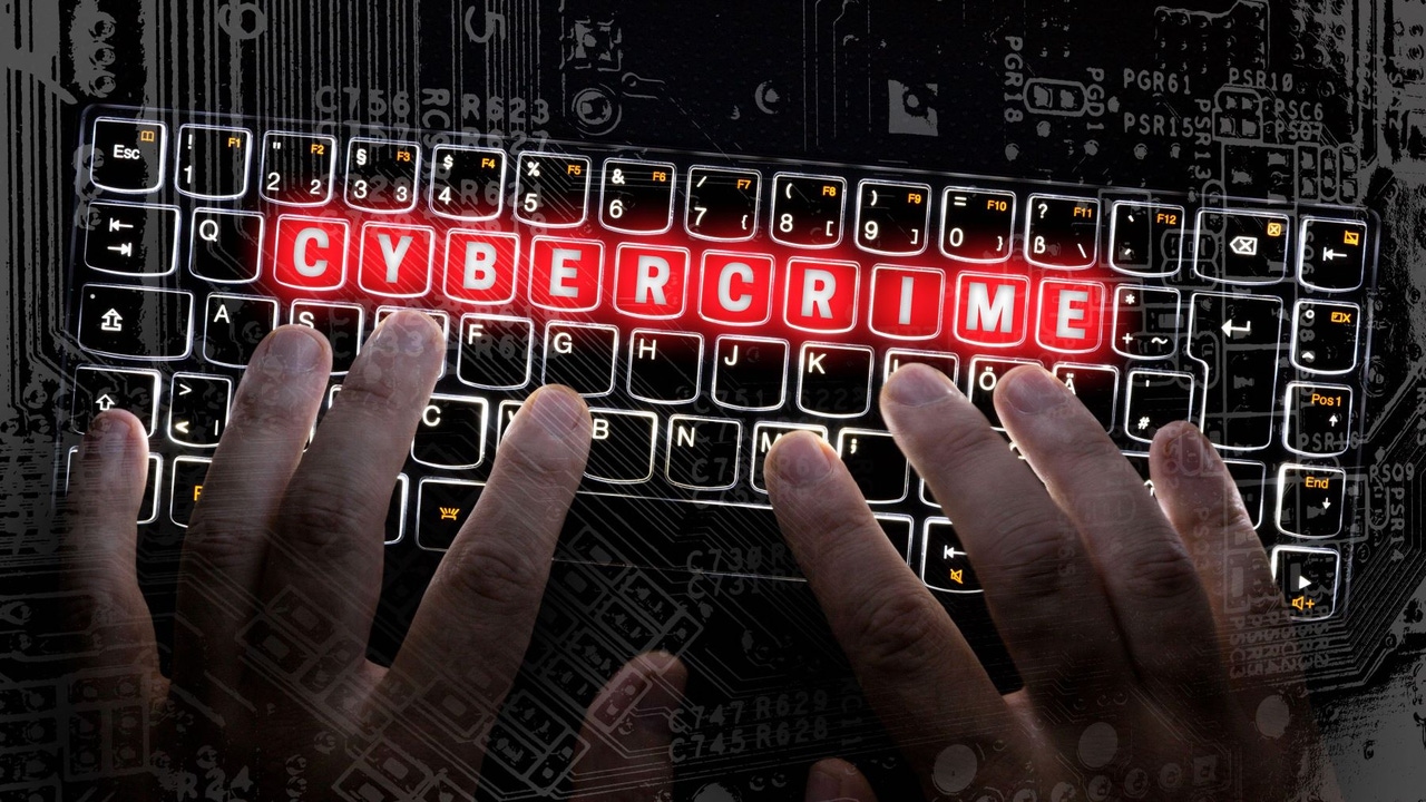 Hands on a laptop keyboard; keys spell out CYBERCRIME Hands on a laptop keyboard; keys spell out CYBERCRIME