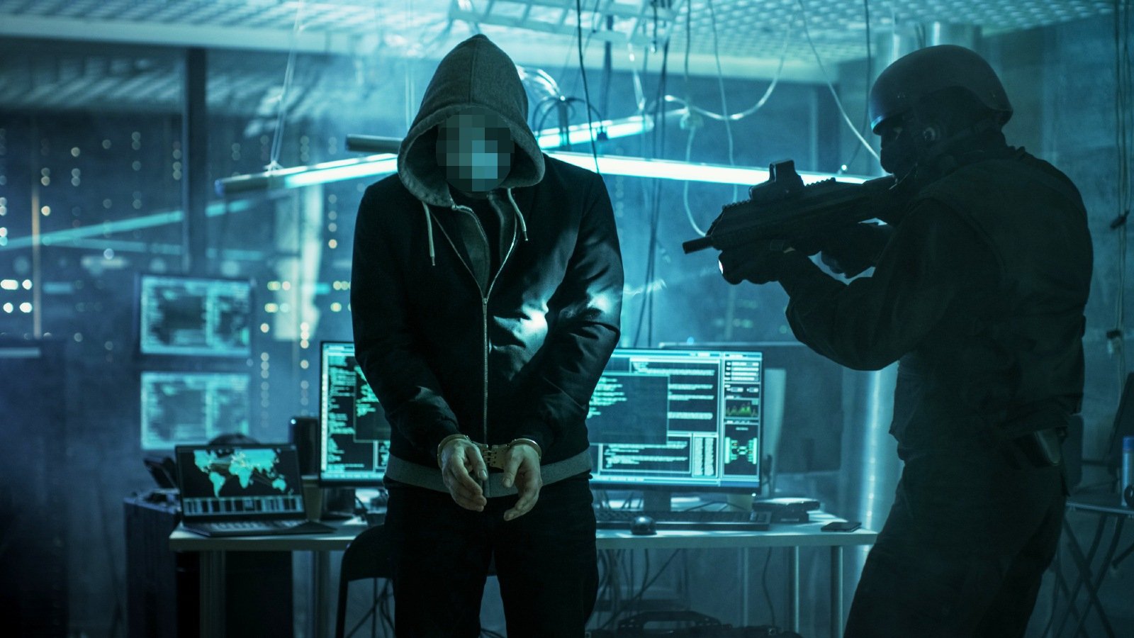 Police arresting a cybercriminal